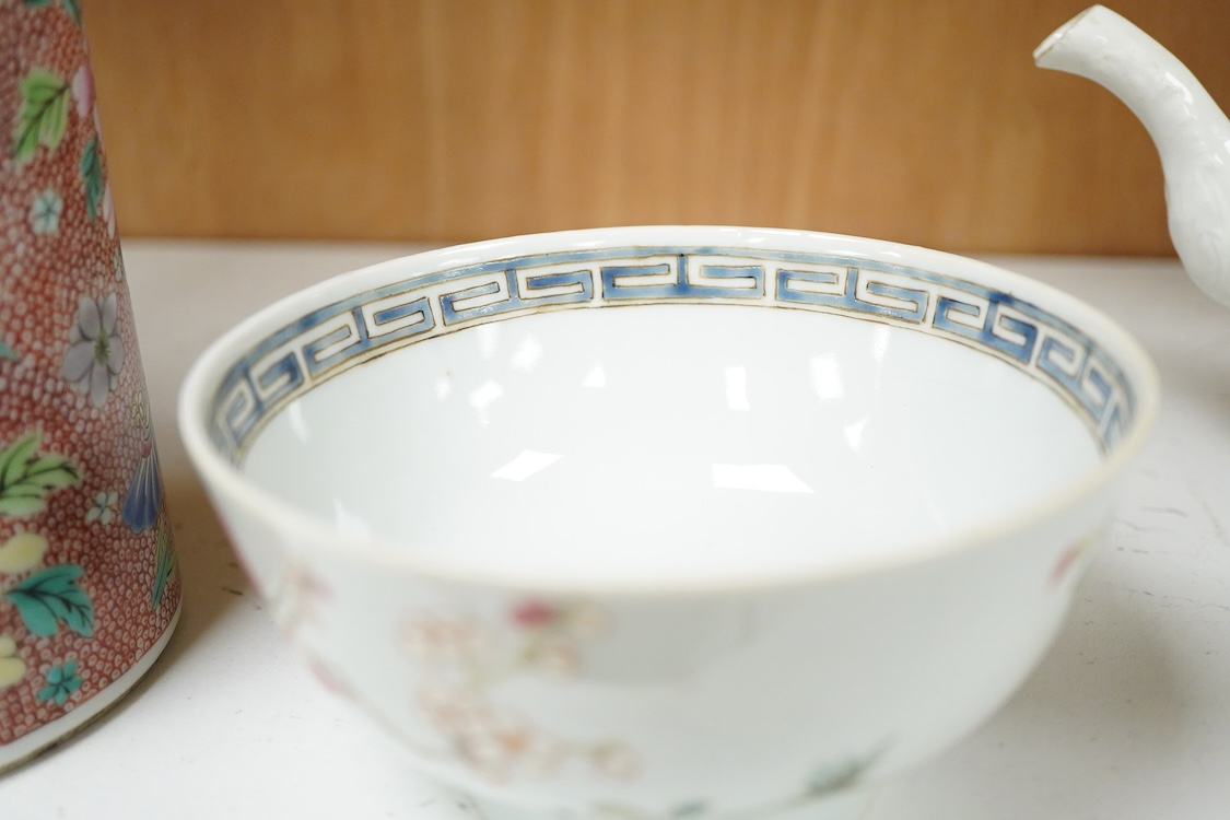 A Chinese famille rose bowl enamelled with a chicken amongst flowers, 12.5cm in diameter